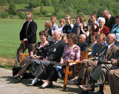 Seated by the memorial