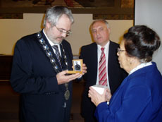 Blazena showing the Mayor of Kladno the watch.